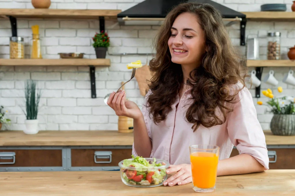 A lady eating salad